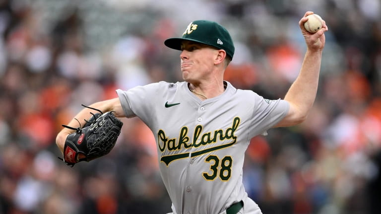 Oakland Athletics starting pitcher JP Sears throws during the second...