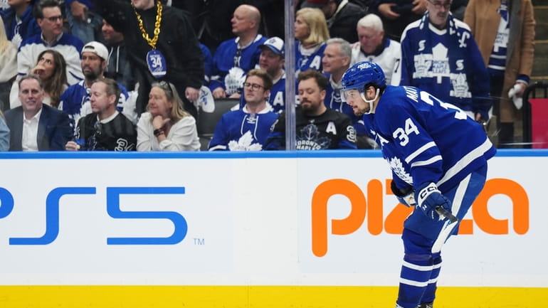 Toronto Maple Leafs' Auston Matthews (34) reacts after Boston Bruins'...
