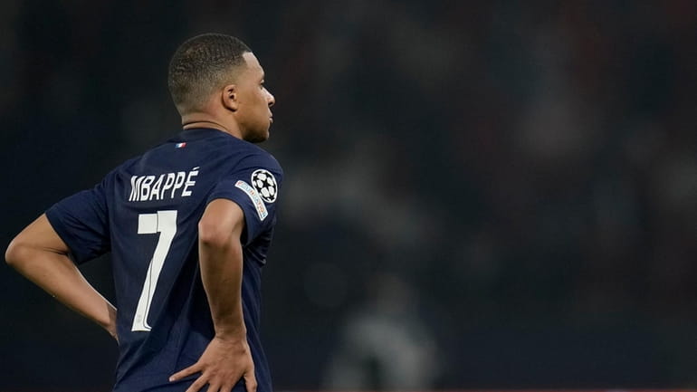 PSG's Kylian Mbappe reacts after the Champions League semifinal second...
