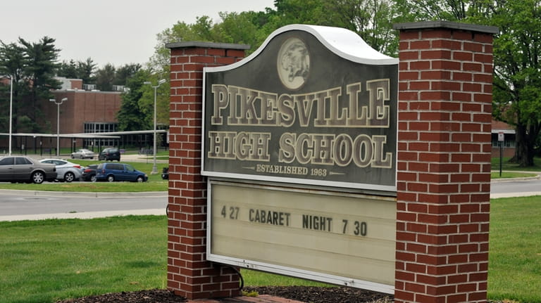 Signage is shown outside on the grounds of Pikesville High...