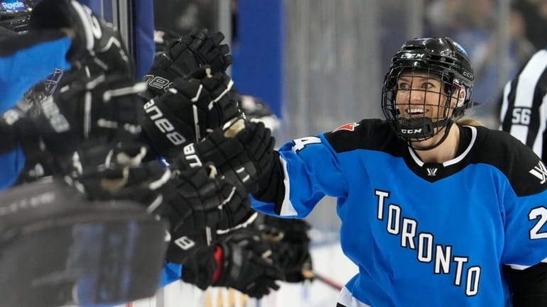 Toronto's Natalie Spooner celebrates after her second goal against Ottawa...