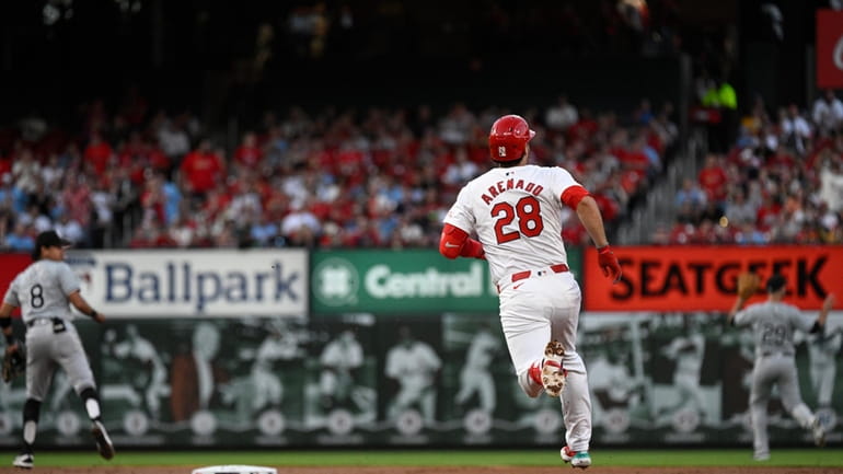 St. Louis Cardinals' Nolan Arenado (28) run the bases after...