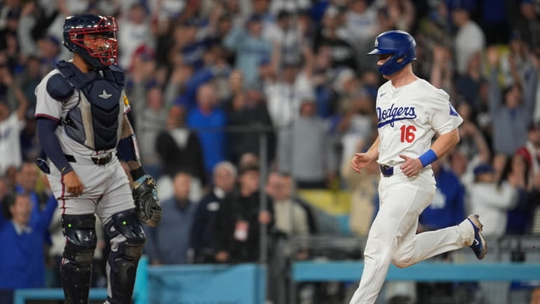 Los Angeles Dodgers' Will Smith (16) scores on a walk-off...