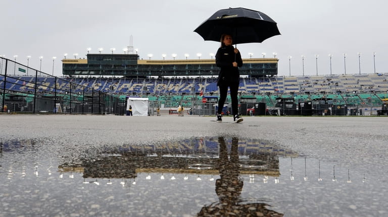 Water pools near the garage area as rain delays a...