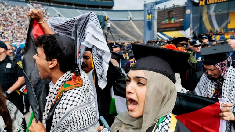 Pro-Palestinian protesters demonstrate during the University of Michigan's Spring 2024...