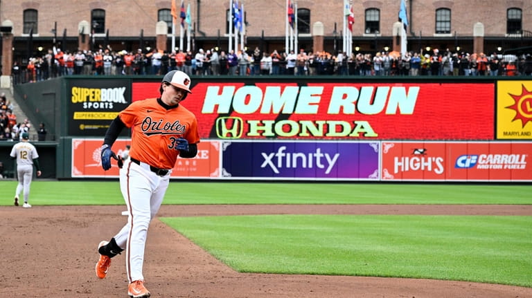 Baltimore Orioles' Adley Rutschman (35) rounds the bases on his...