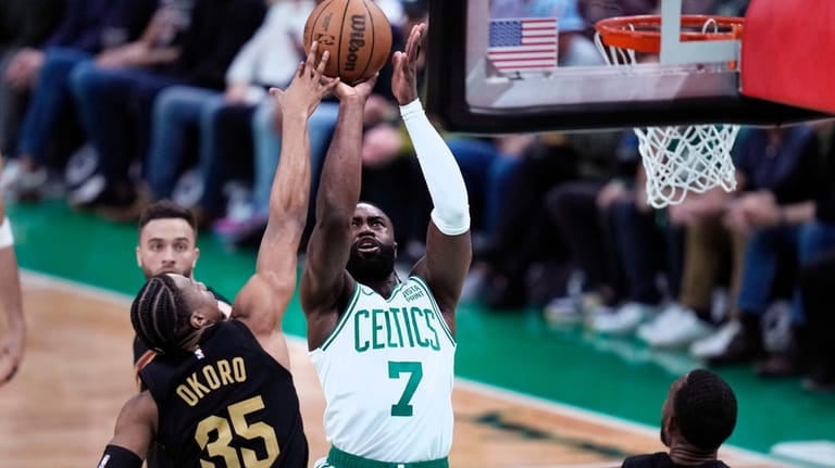 Boston Celtics guard Jaylen Brown (7) shoots against Cleveland Cavaliers...