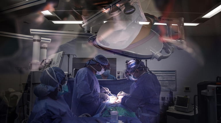 A double exposure of an operating room during surgery.