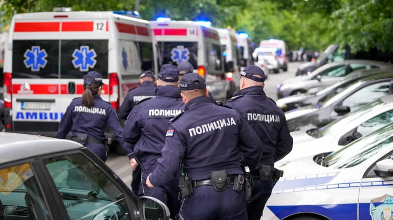 Police officers block the streets surrounding the Vladislav Ribnikar school...