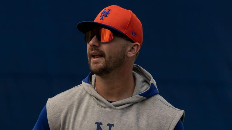 Mets infielder Pete Alonso looks on during a spring training...