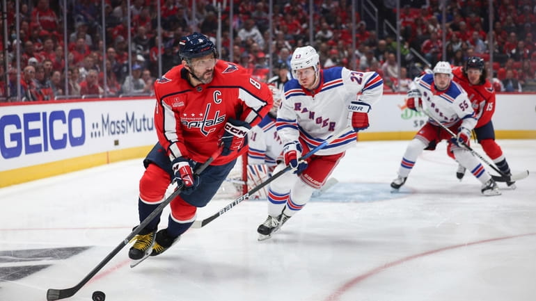 Washington Capitals left wing Alex Ovechkin skates with the puck...