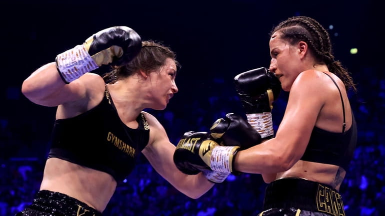 Katie Taylor, left, and Chantelle Cameron fight during their undisputed...