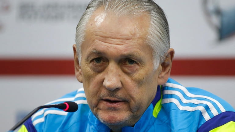 Ukraine's national soccer team head coach Mykhailo Fomenko speaks during...