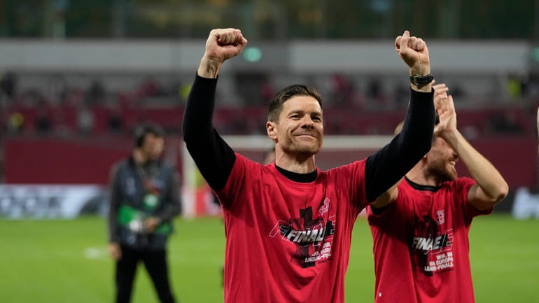 Leverkusen's head coach Xabi Alonso celebrates at the end of...
