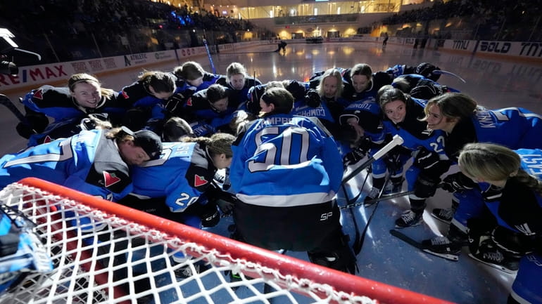 Toronto players take part in a huddle for their last...