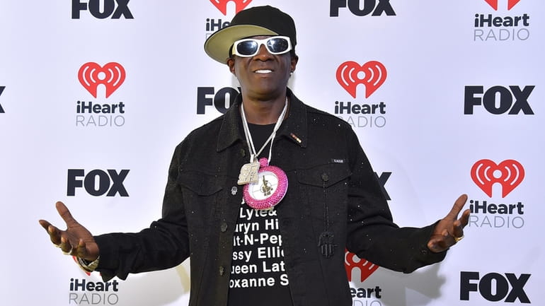 Flavor Flav arrives at the iHeartRadio Music Awards on Monday,...