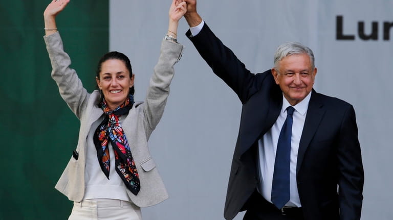 Mexico's President Andres Manuel Lopez Obrador, right, and Mayor Claudia...