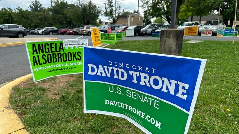 Signs are pictured outside an early voting center on Thursday,...