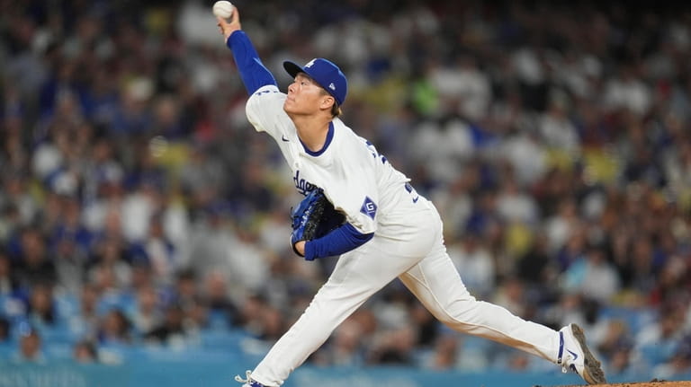 Los Angeles Dodgers pitcher Yoshinobu Yamamoto throws to a Miami...