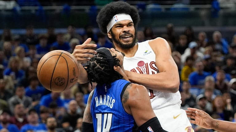 Cleveland Cavaliers center Jarrett Allen, right, is fouled by Orlando...