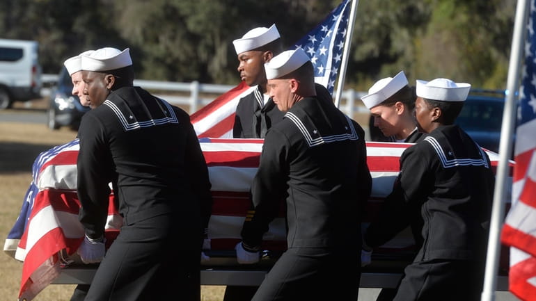 Sailors carry the casket of Cameron Walters at Oak Hill...