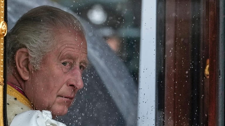 Britain's King Charles III makes his way to Westminster Abbey...