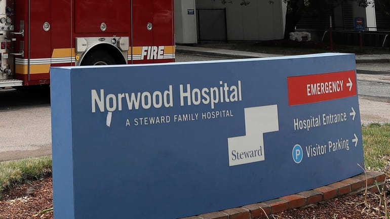 The sign for Norwood Hospital, a Steward Health Care hospital,...
