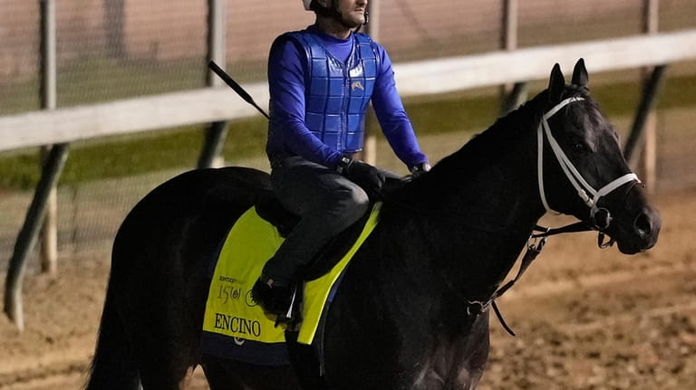 Kentucky Derby hopeful Encino works out at Churchill Downs Tuesday,...