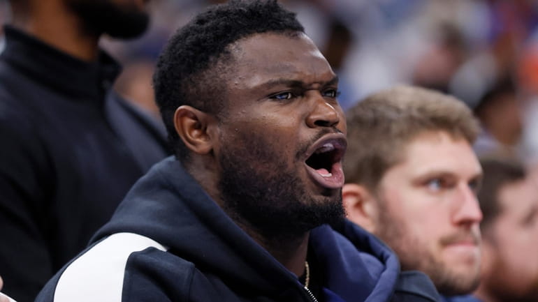 New Orleans Pelicans forward Zion Williamson shouts from the bench...
