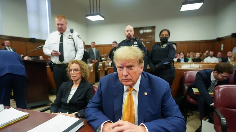 Former President Donald Trump, joined by his attorney Susan Necheles,...