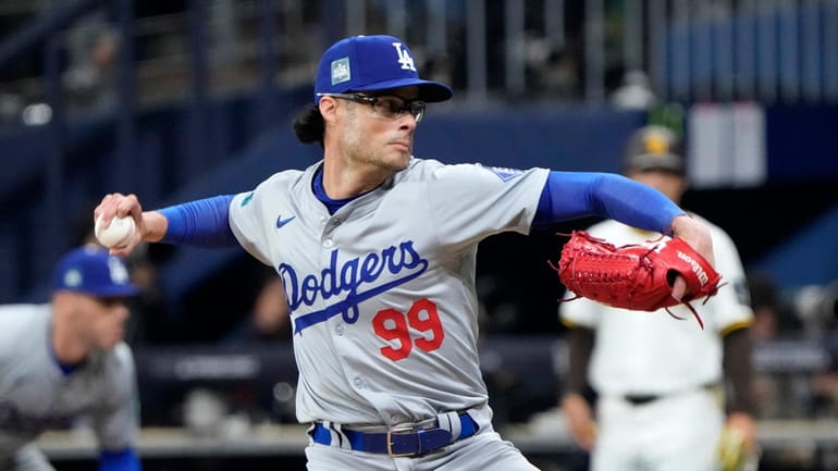 Los Angeles Dodgers relief pitcher Joe Kelly throws to the...