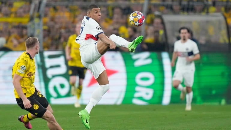 PSG's Kylian Mbappe is in action during the Champions League...