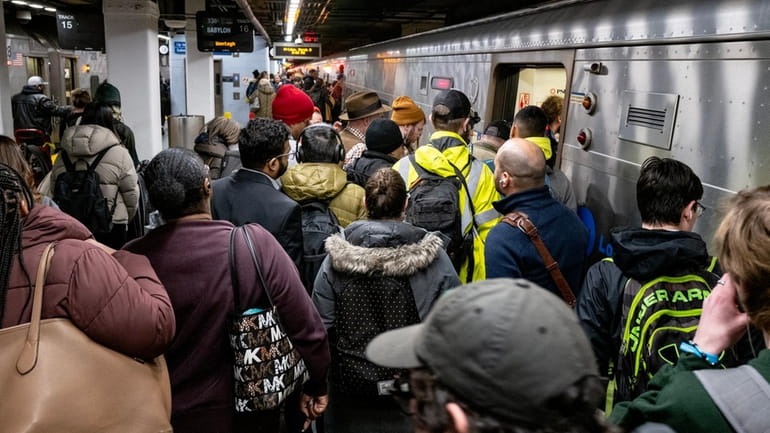 LIRR passengers board a train at Penn Station on March 3....