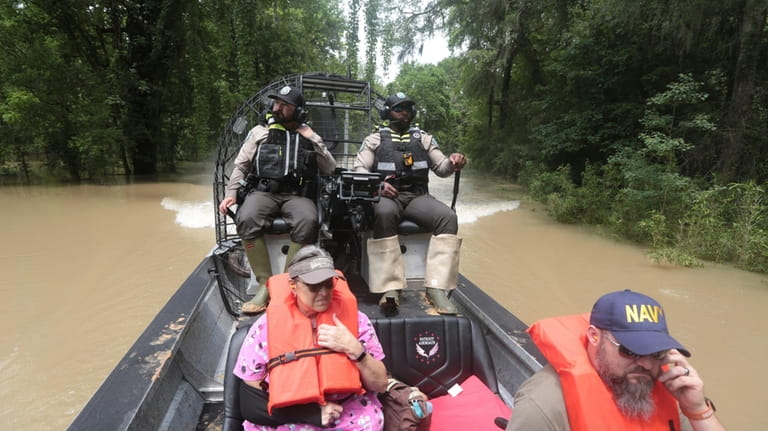 Texas Parks & Wildlife Department game wardens rescue residents from...