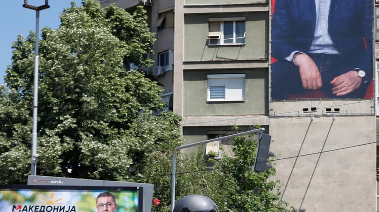 Posters of Hristijan Mickoski, the leader of the center-right main...