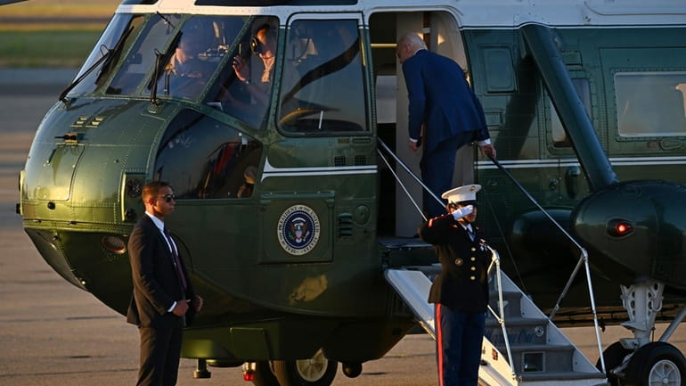 U.S. President Joe Biden boards Marine One at Moffett Airfield...
