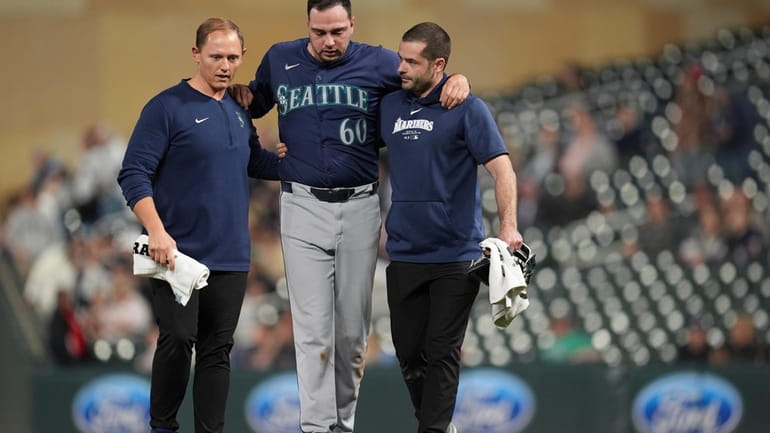 Seattle Mariners relief pitcher Tayler Saucedo (60) walks off the...