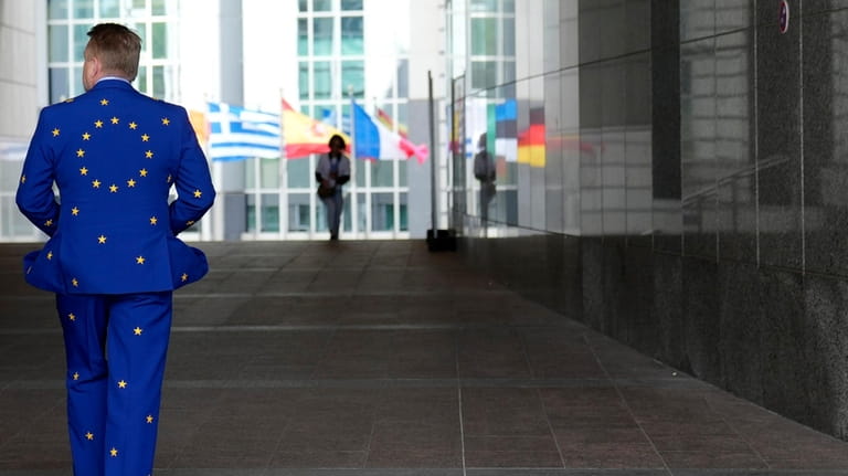 A man wears a suit in the EU colors as...