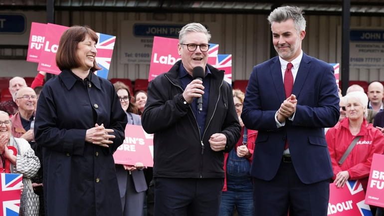 Britain's Labour Party leader Sir Keir Starmer, center, and shadow...