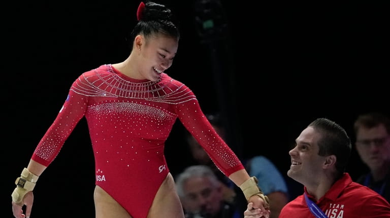 United States' Leanne Wong celebrates with her coach after her...