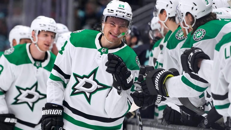 Dallas Stars center Roope Hintz is congratulated for a goal...