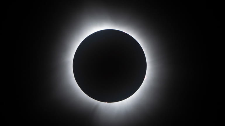 The moon covers the sun during a total solar eclipse...
