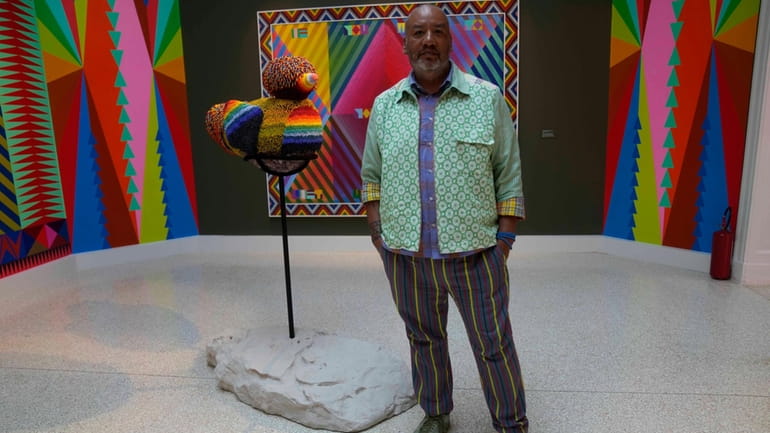 Artist Jeffrey Gibson poses inside the US pavilion during the...
