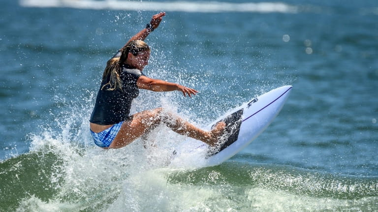Symca Sachs surfs during a competition in Long Beach.