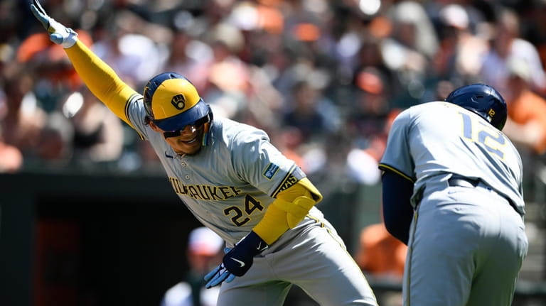 Milwaukee Brewers' William Contreras, left, celebrates after his home run...