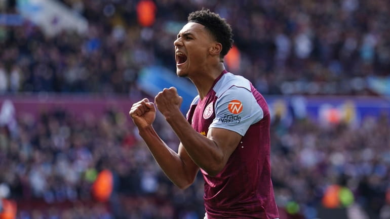 Aston Villa's Ollie Watkins celebrates after team-mate Moussa Diaby scores...