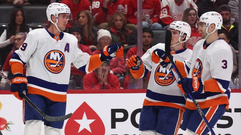 Brock Nelson of the Islanders celebrates his first-period goal with...