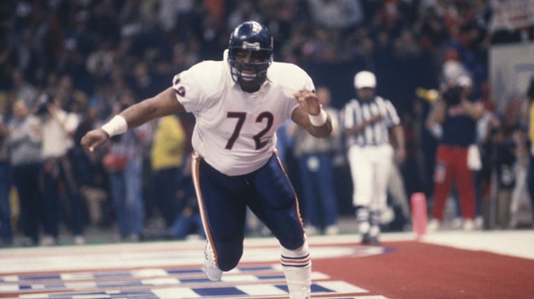 William "The Refrigerator" Perry of the Chicago Bears runs in...