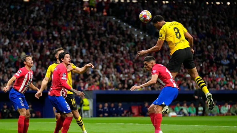 Dortmund's Felix Nmecha, right, makes an attempt to score during...