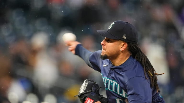 Seattle Mariners starting pitcher Luis Castillo works against the Colorado...